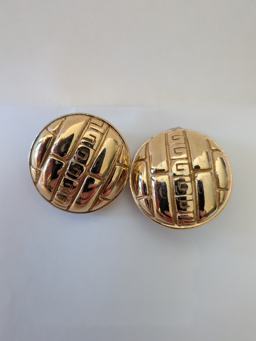 Givenchy Shiny Gold Round Clip-On Earrings with Geometric Relief